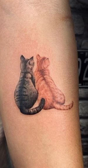 Tatouage de deux chats ensemble